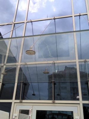 Glass canopy on glass facade